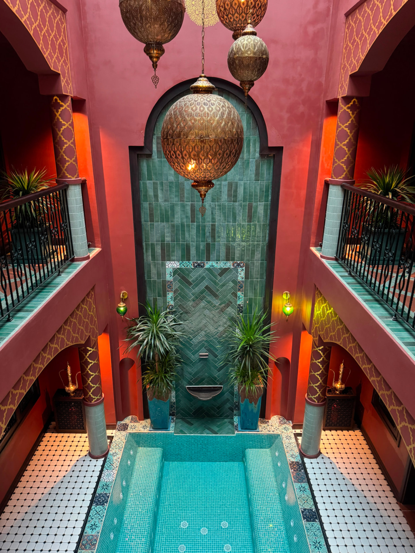 Courtyard plunge pool and tiled arch inside a boutique riad property